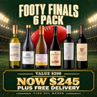 Promotional graphic for a 6-pack of wines labeled 'FOOTY FINALS'. Six wine bottles are lined up in front of a football on a stadium field at night.